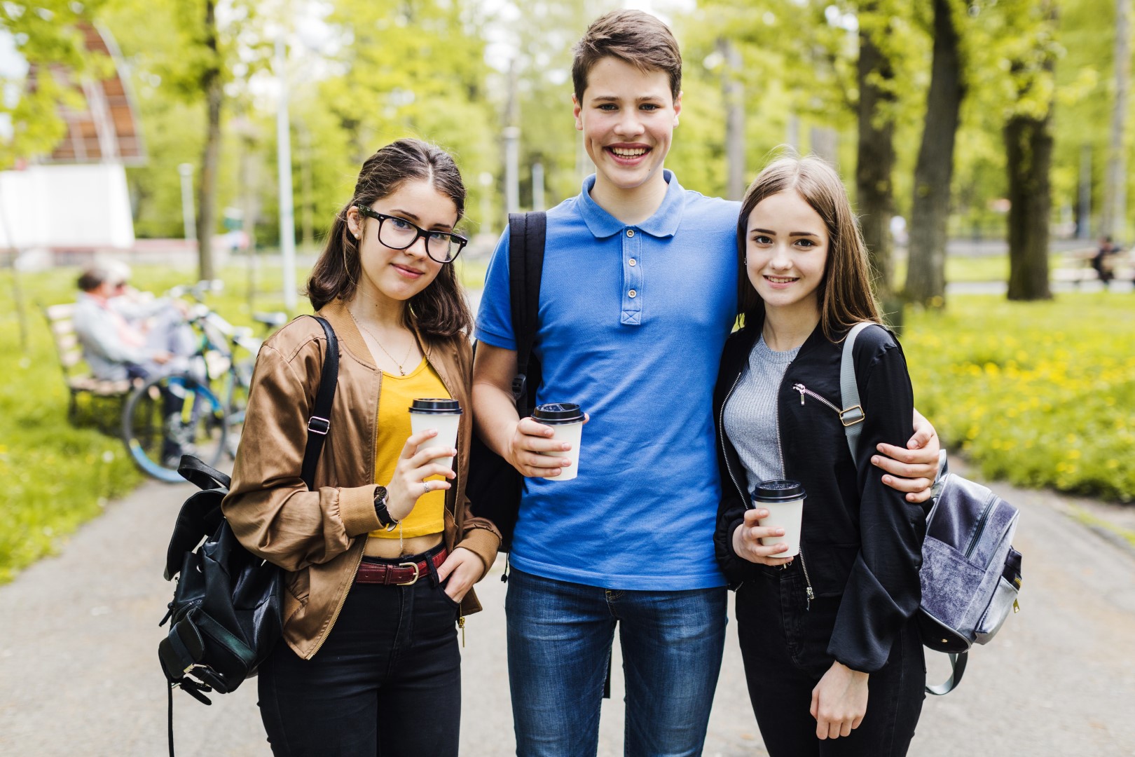 students-posing-with-cups-coffee